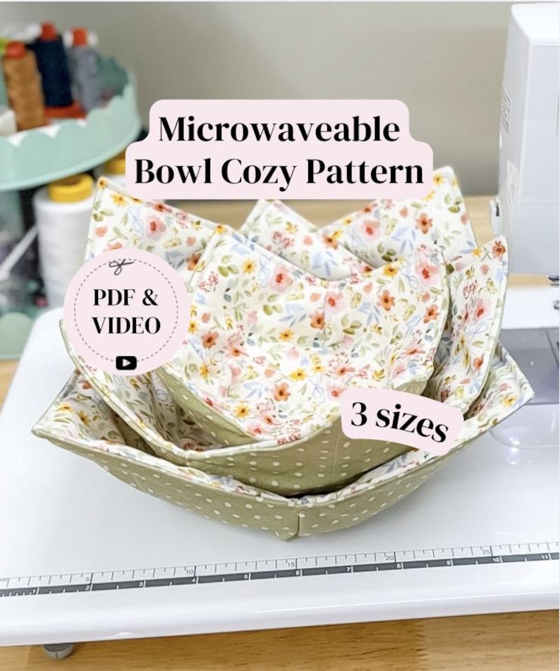 May include: Three microwaveable bowl cozies in different sizes, stacked on top of each other. The cozies are made of floral and polka dot fabric. The text "Microwaveable Bowl Cozy Pattern", "PDF & VIDEO", and "3 sizes" are visible.