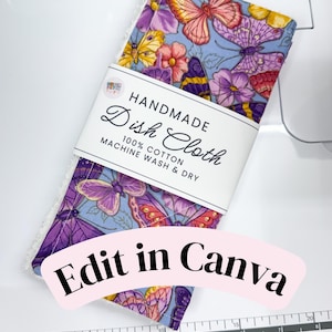 May include: A rectangular dish cloth featuring a light blue background with a colorful pattern of butterflies and flowers. A white paper band wraps around the center with the text HANDMADE Dish Cloth 100% COTTON MACHINE WASH & DRY.