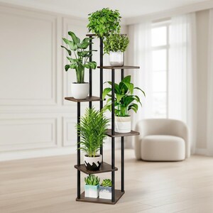 May include: A multi-tiered plant stand with dark brown shelves and black metal supports. The stand holds various potted plants with green foliage, including a large leafy plant and smaller succulents. The stand is approximately 60 inches tall.