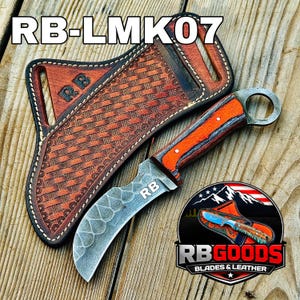 May include: A curved blade knife with an orange and gray handle and a finger ring, accompanied by a brown leather sheath. The knife blade has a unique pattern and the sheath has a woven design. The text "RB-LMK07" is at the top.