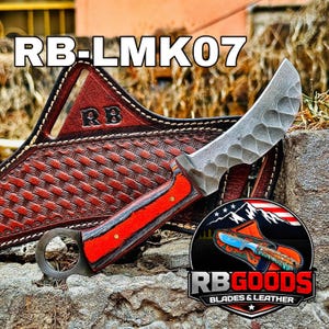 May include: A handcrafted knife with a curved blade and a red and gray handle. The blade has a textured surface. The knife is displayed with a brown leather sheath. The text "RB-LMK07" is at the top of the image, and the logo "RB GOODS BLADES & LEATHER" is at the bottom.