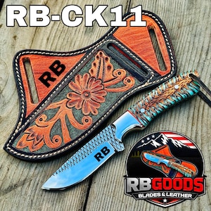 May include: A custom knife with a turquoise handle and a patterned blade, displayed with a tooled leather sheath. The sheath is orange and black with floral designs and the initials "RB". The knife blade has the initials "RB" and the text "RB-CK11".