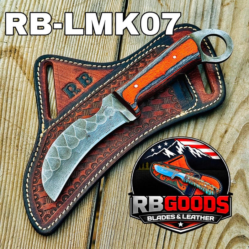 May include: A custom knife with an orange and wood handle, a curved blade, and a ring at the end. The knife rests in a brown leather sheath with the initials "RB" embossed on it. The text "RB-LMK07" is at the top.
