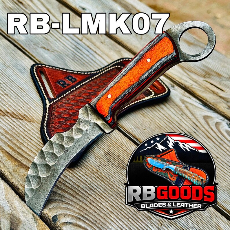 May include: A curved blade knife with an orange and brown handle and a metal ring at the end. The knife rests on a brown leather sheath. The text "RB-LMK07" is at the top. The logo "RB GOODS BLADES & LEATHER" is at the bottom.
