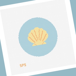May include: A square needlepoint canvas featuring a light blue circular background with a pale yellow seashell design centered in the middle. The letters SPS are printed in orange in the bottom left corner of the white grid fabric.
