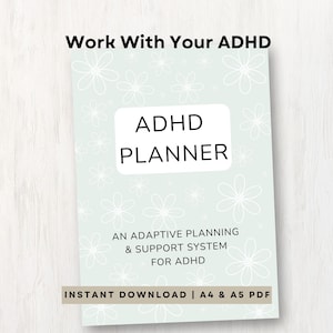 Puede incluir: Un planificador de TDAH verde claro con detalles florales blancos y el texto "ADHD PLANNER". El planificador incluye el texto "AN ADAPTIVE PLANNING & SUPPORT SYSTEM FOR ADHD". Las palabras "Work With Your ADHD" están arriba.