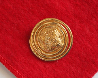 Broche redondo vintage YSL Yves Saint Laurent, França em tom dourado / Pin #2877