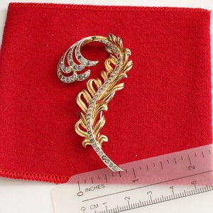 Signed  Jomaz Gold  and  silver tone rhodium feather brooch with  Swarovski Crystals  #2965