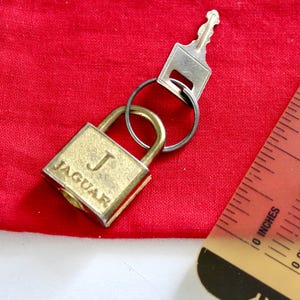Vintage Jaguar-bagageslot met sleutel, accessoirebedel