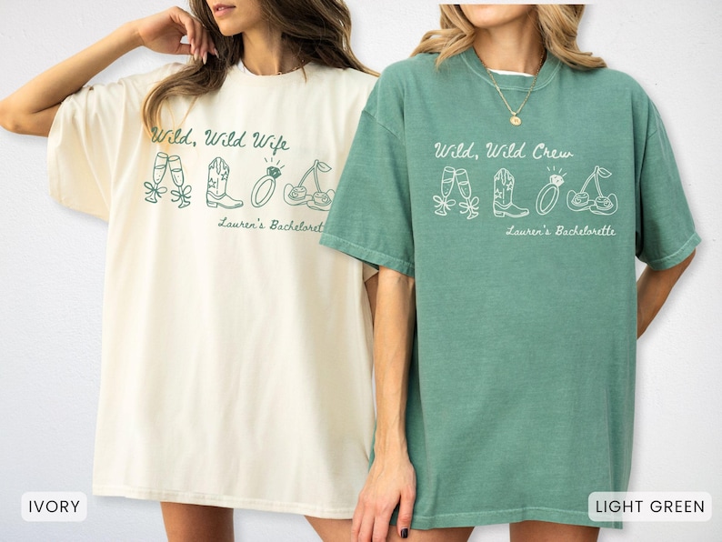Puede incluir: Dos camisetas de gran tama&ntilde;o, una marfil y otra verde claro, con texto gr&aacute;fico blanco e ilustraciones. La camiseta marfil dice "Wild, Wild Wife" y la camiseta verde dice "Wild, Wild Crew". Ambas camisetas tienen "Lauren's Bachelorette" impreso debajo.