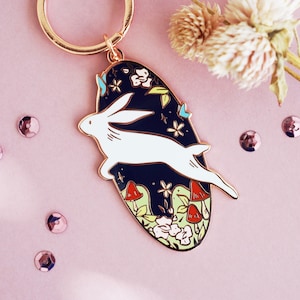 Rabbit Jumping in Forest with Mushrooms Hard Enamel Rose Gold Plated Keychain