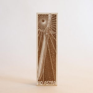 May include: A rustic wooden sign with the text "Welcome to our home" in white lettering. The sign features a distressed finish and a simple, inviting design, perfect for entryway decor.