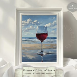 Puede incluir: Impresión enmarcada de una copa de vino tinto en una playa, con cielo azul y nubes. La obra de arte, enmarcada en blanco, tiene el texto "Download & Print in Minutes" en la parte inferior.