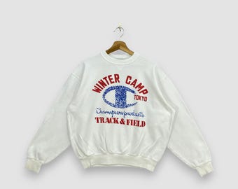 Sudadera vintage de los 90 de Champion Products, blanca, para el campamento de invierno de Tokio, de atletismo, con cuello redondo, talla L.