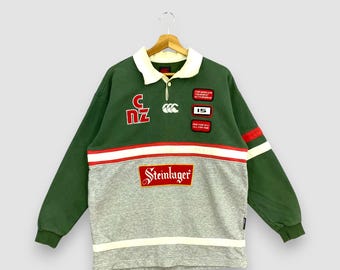 Camiseta de rugby vintage Canterbury Steinlager, talla grande, jersey con cuello Canterburry n.° 15, jersey de rugby de Nueva Zelanda, estilo All Blacks, talla L