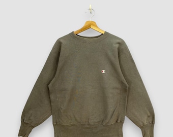 Sudadera Champion Reverse Weave vintage de los 90, color verde oliva, cuello redondo, jersey deportivo, talla M.