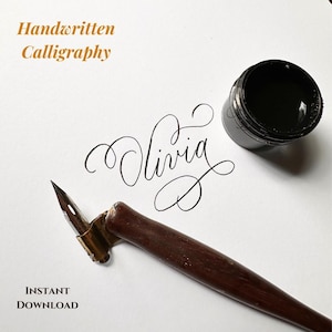 May include: A brown wooden oblique calligraphy pen holder with a metal nib, a small jar of black ink, and the name Olivia written in black cursive script on white paper. The text Handwritten Calligraphy and INSTANT DOWNLOAD are visible.