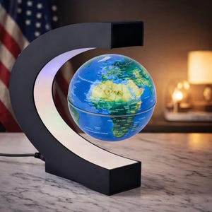 May include: A levitating globe with a detailed map of the world, suspended in mid-air within a black, C-shaped frame. The frame has a white light strip. The globe is blue and green, and the base is black.