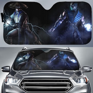 May include: Car windshield sunshade featuring two characters from a video game. One character is in a blue and white outfit with a straw hat, and the other is in a blue and black outfit. Both characters are surrounded by lightning.