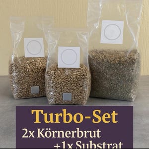 May include: Three transparent bags filled with grains and substrate. Two bags contain light brown grains, and the third bag has a darker, granular substance. Each bag has a white label with a circle and a small square. The text "Turbo-Set" is visible.