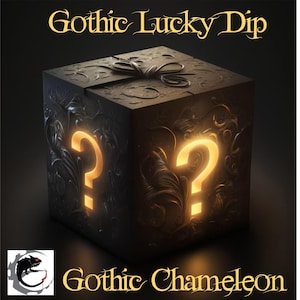 May include: A dark, ornate box with glowing question marks on multiple sides. The box is tied with a bow and features the text "Gothic Lucky Dip" and "Gothic Chameleon". The overall theme is mysterious and gothic.