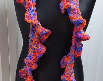 Crochet corkscrew boa in variegated orange, blue and red chenille