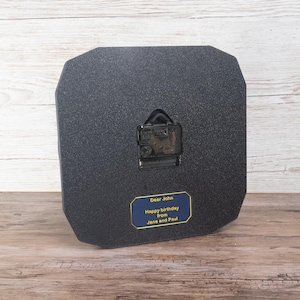 Pilot gift wall clock modeled after a Cessna aircraft cockpit altimeter. This aviation decor features realistic flight instrument details, a black bezel, and white dial lettering and clock hands.