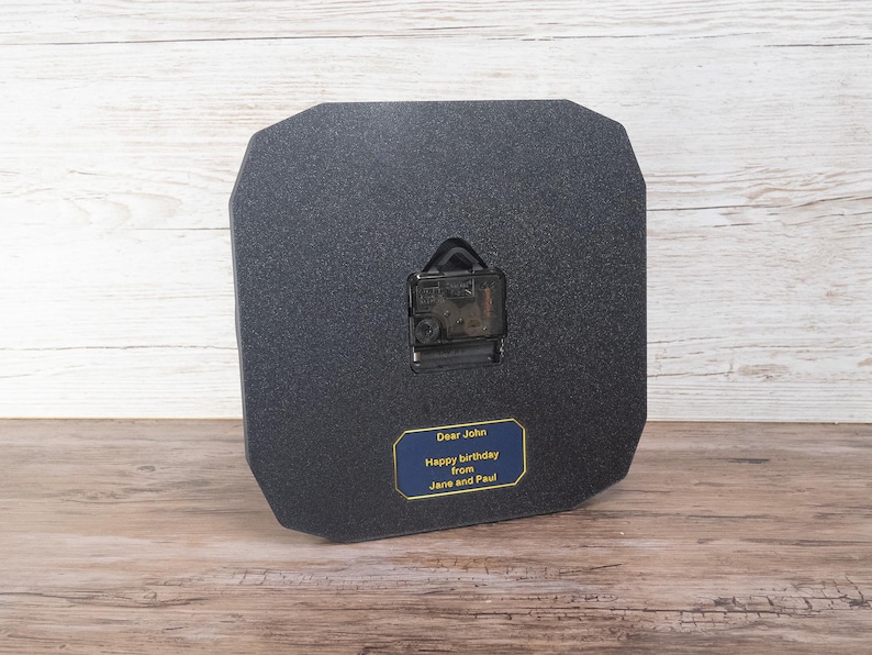 Pilot gift wall clock modeled after a Cessna aircraft cockpit altimeter. This aviation decor features realistic flight instrument details, a black bezel, and white dial lettering and clock hands.
