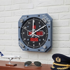 Pilot gift wall clock modeled after an Airbus aircraft cockpit chronometer. This aviation decor features realistic flight instrument details, a grey bezel, and digital time displays.