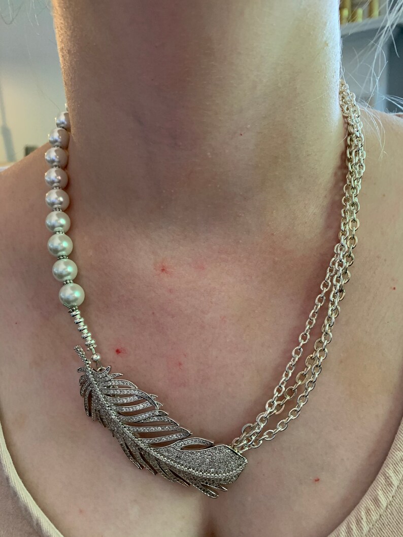 silver chain supporting a beautiful feather focal piece. Feather Gift necklace was created with white pearls
