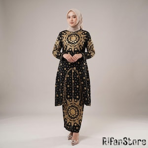 dress songket modern style A modern design using Kain Songket from Palembang in valentino red for @arianinismaputri. The dress was lightly gold-beaded, and a matching golden lace was sewn on her Hijab. All that combined with