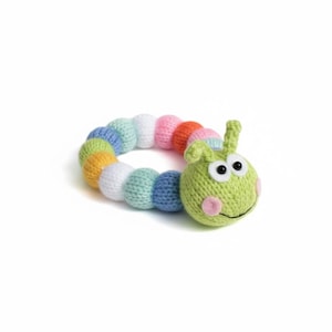 May include: A colorful, knitted caterpillar toy with a green head, large white eyes, and pink cheeks. The segmented body features a rainbow of colors, including orange, pink, white, blue, and green. This soft toy is designed for babies and young children.