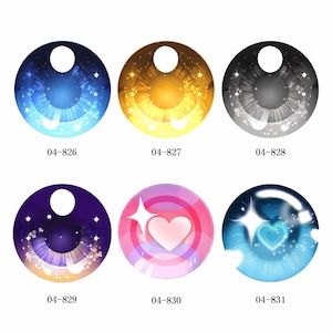 May include: Six colorful eye designs with a white circular highlight. The eyes are blue, gold, gray, purple, pink, and blue. Each eye has a unique pattern with stars and a heart. The numbers 04-826, 04-827, 04-828, 04-829, 04-830, and 04-831 are printed below each eye.
