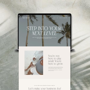 May include: A laptop screen displaying a website with a gray background, palm trees, and the text "STEP INTO YOUR NEXT LEVEL." Below, a section features a photograph of a person in white clothing and the text "You're not here to play small. You're here to grow."