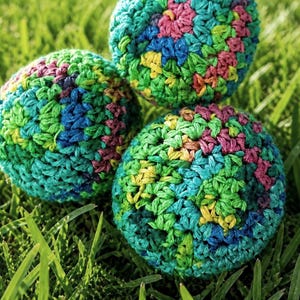 rainbow hacky sack, colors may vary based on dye lot and natural variations in yarn coloring and texture.