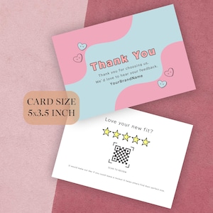 以下が含まれることがあります： ピンクとブルーのデザインのグリーティングカード2枚。上のカードにはハートのデザインで「Thank You」と書かれています。下のカードにはQRコードと星評価で「Love your new fit?」と書かれています。カードサイズは12.7 x 8.9 cmです。