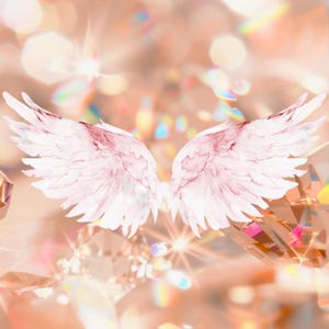 May include: A pair of pale pink, feathered angel wings centered against a background of multifaceted, sparkling crystals that reflect light in warm, golden, and iridescent tones, creating a bright and luminous visual effect throughout the composition.