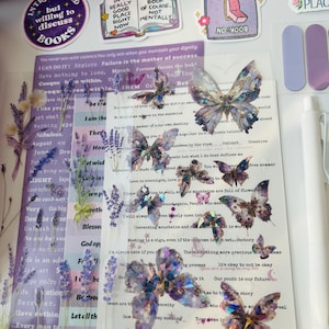 May include: A collection of decorative stickers and embellishments, including butterfly and floral designs, along with inspirational quotes. The color palette includes purple, white, and iridescent elements, perfect for scrapbooking or journaling.