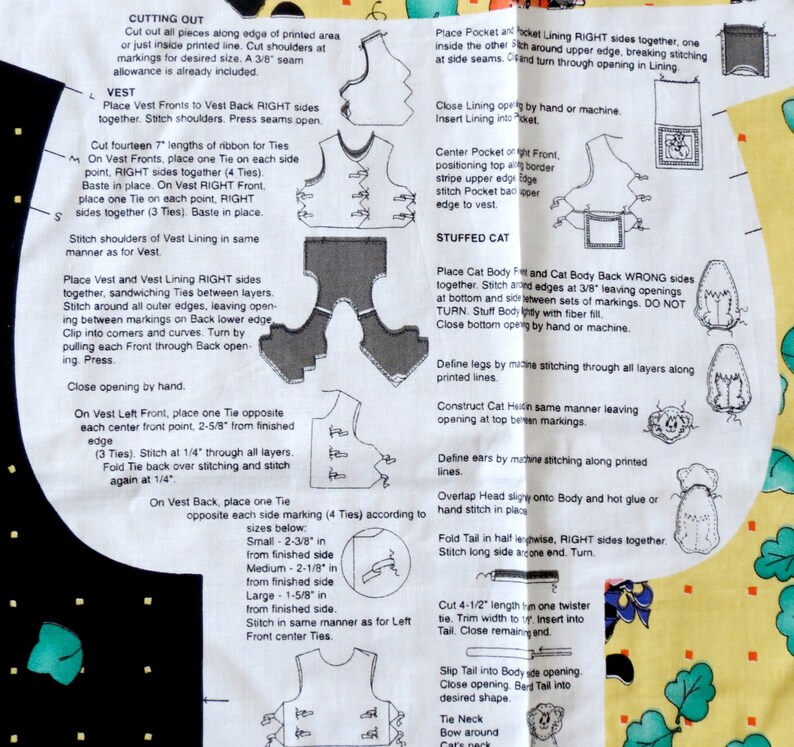 May include: A sewing pattern sheet with instructions and diagrams for making a vest and a stuffed cat. The instructions include cutting, stitching, and assembling the fabric pieces. The sheet has text and illustrations.