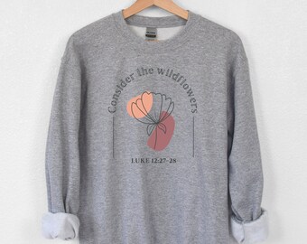 May include: Gray sweatshirt with a floral design and the text "Consider the wildflowers" and "LUKE 12:27-28".