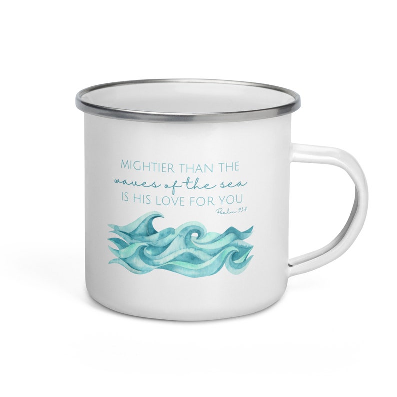 May include: White enamel mug with a blue watercolour design of waves and the text "MIGHTER THAN THE waves of the sea IS HIS LOVE FOR YOU Psalm 93:4"