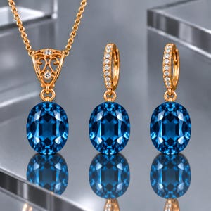 Oorbellen met druppelvormige hangers van 14 karaats goud en Londense blauwe topaas: ovaal geslepen sieradenset, geboortesteen van december.