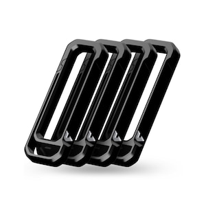 May include: Four black, rectangular phone cases are arranged diagonally against a white background. The cases have a thick, angular design with a hollow center. The cases are made of a glossy material.