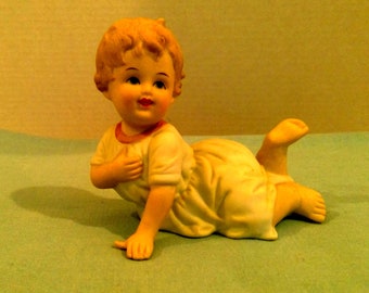 Andrea by Sadek Piano Baby Porcelain Figurine