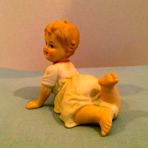 Andrea by Sadek Piano Baby Porcelain Figurine