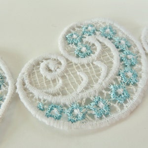 White Paisley Cotton Net Applique Trim with Small Blue Daisy Floral Pattern