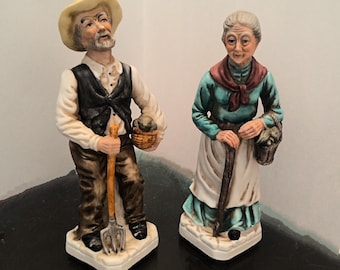 Ceramic Farmer With A Pitch Fork and His Wife With A Walking Stick