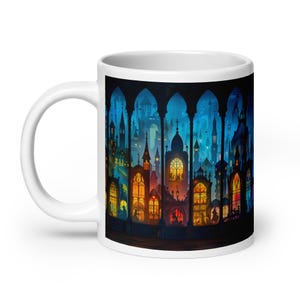 May include: White ceramic mug featuring a colorful illustration of a cityscape with gothic architecture. The artwork showcases a vibrant array of colors, including blues, oranges, and yellows, creating a whimsical and detailed design.