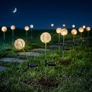 May include: A night scene featuring solar-powered dandelion lights in a garden. The lights are white, spherical, and resemble dandelions. The stems are green, and the bases are black. The night sky is dark blue with a crescent moon.