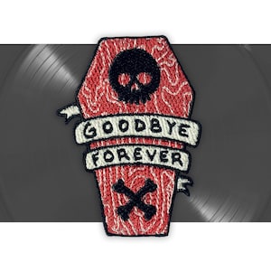 May include: Embroidered patch in the shape of a coffin, with a red background and a wood grain pattern. A black skull is at the top, with the words "GOODBYE FOREVER" on a banner. Below the banner are crossed bones.